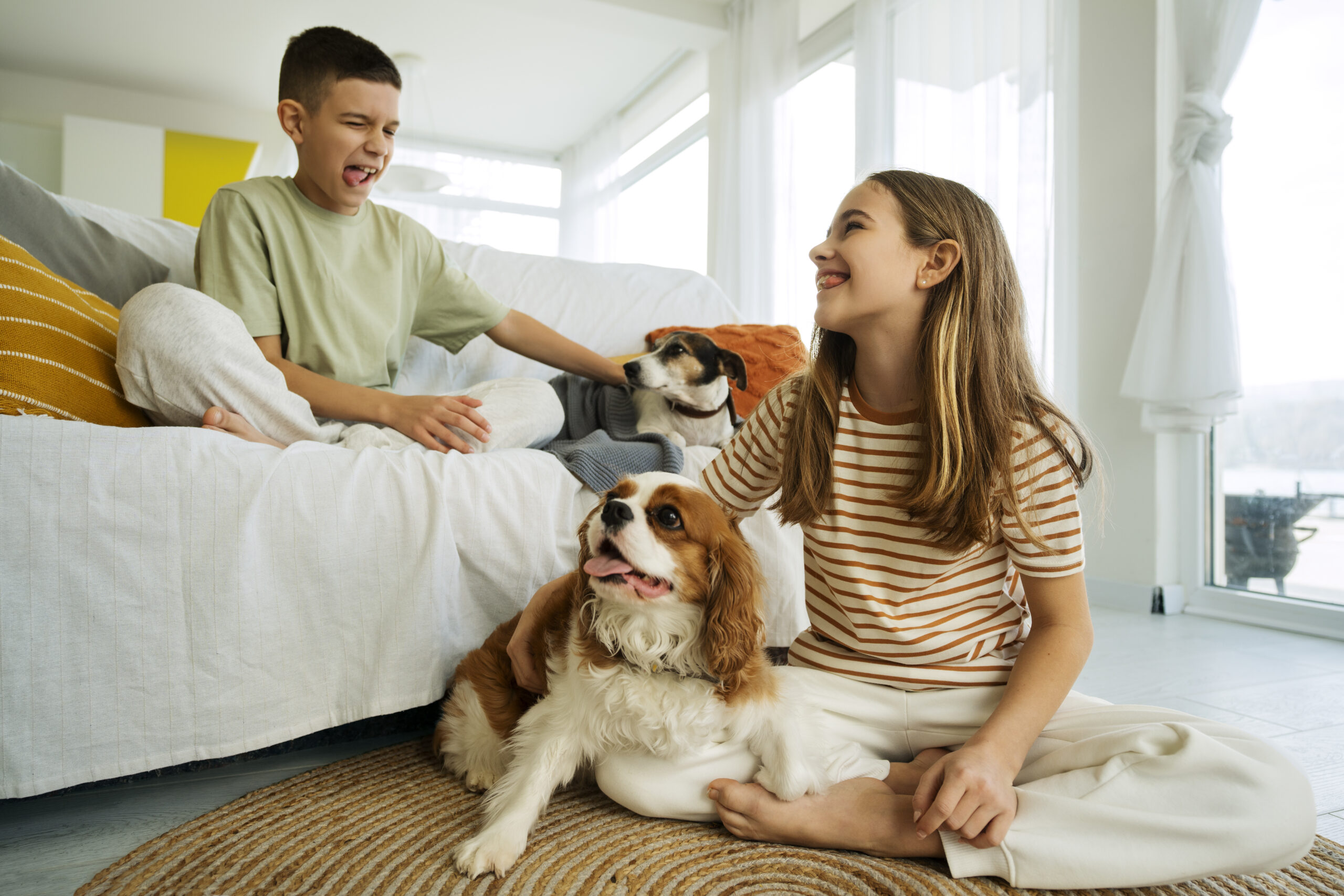 Texas family relaxing at home with their dog after lowering their FHA mortgage payment with the Streamline Refinance program