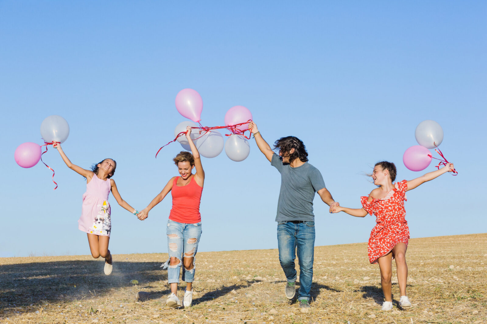 Family celebrating outside their new San Antonio area home