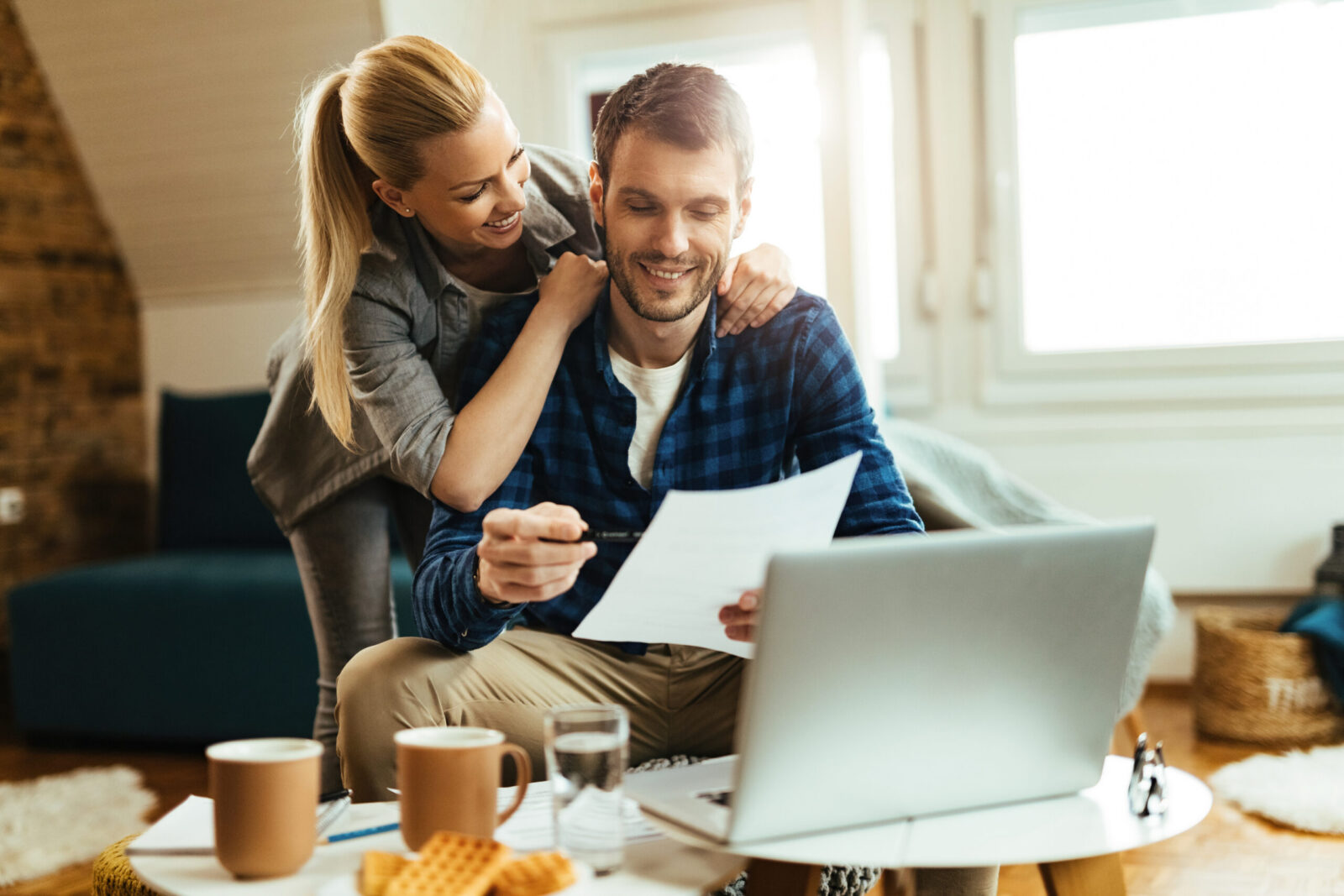 San Antonio couple reviewing home loan options and property tax estimates at home