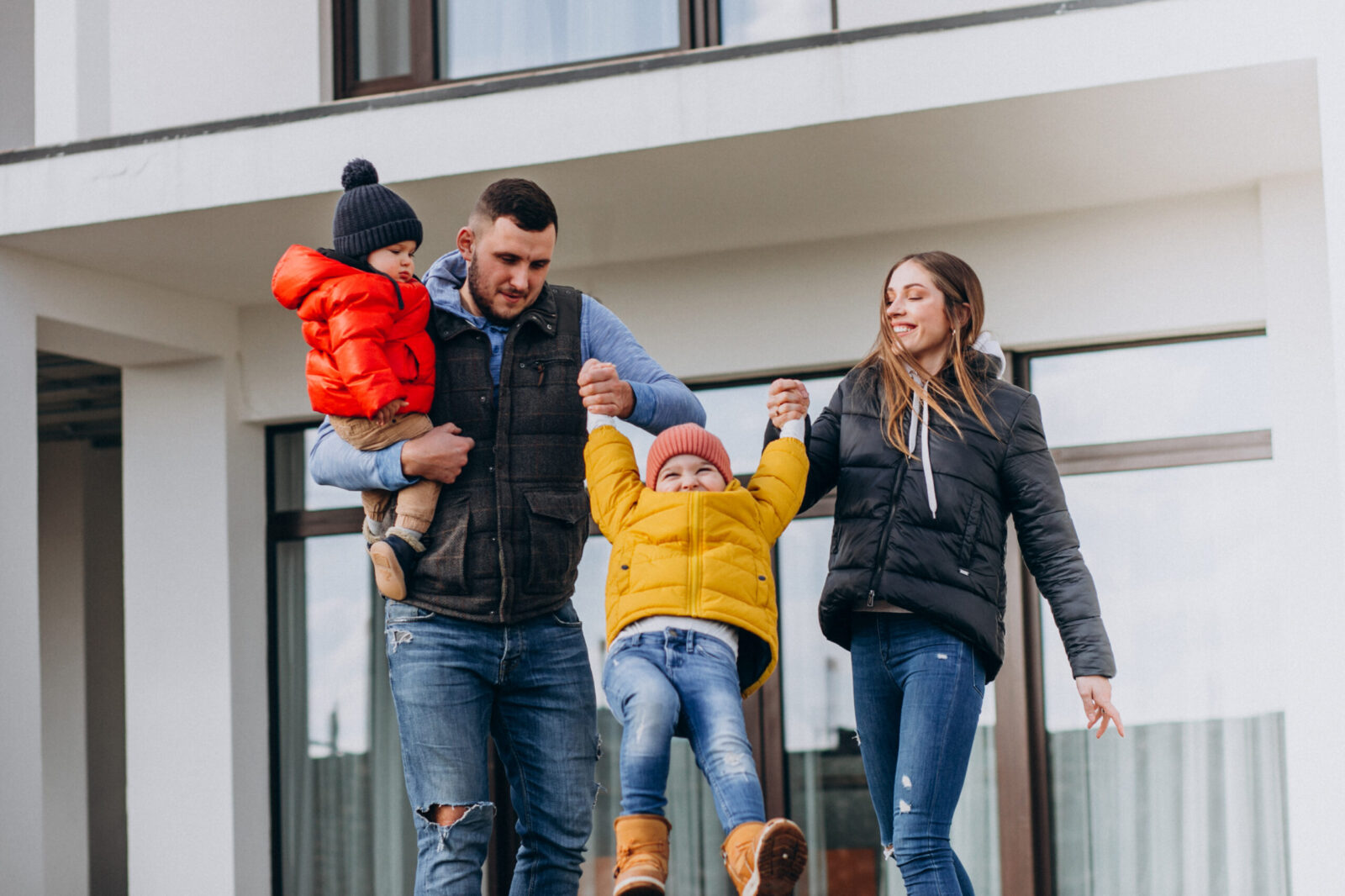 Family with two young children outside their new Schertz, Texas home