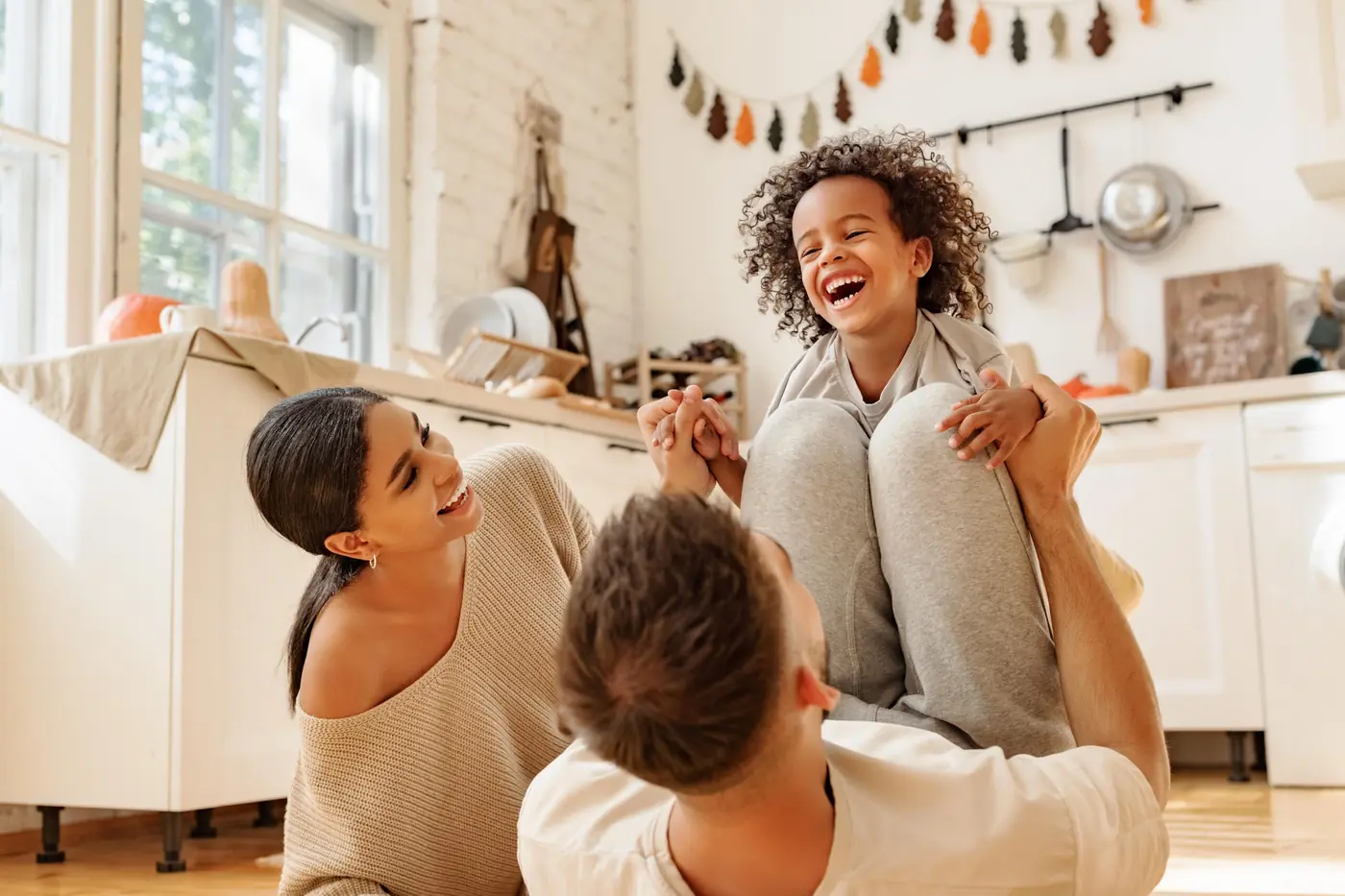 Happy Texas family together at home — your dream home awaits with Texas mortgage broker Adam Bartling